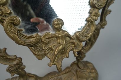 null Bronze psyche mirror decorated with cherubs, shells and foliage.
19th century
Height...
