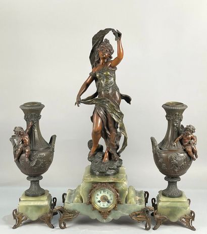 null After MOREAU
Onyx and patinated bronze/regule mantel set including a clock and...
