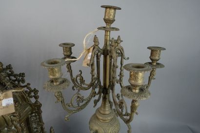null Gilded metal mantel set including a clock and two candelabras decorated with...
