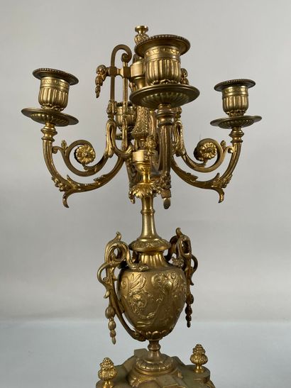 null Gilded metal mantel set including a clock and a pair of candelabras.
(Accidents,...
