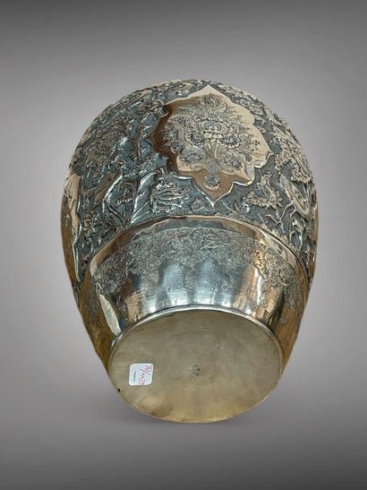 null IRAN 
A silver ovoid vase with a small annular neck, embossed and engraved with...