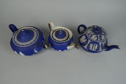 null WEDGWOOD
Set of three teapots, two covered, decorated with antique cameo scenes...