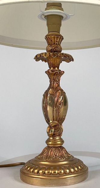 null Gilded metal lamp base decorated with foliage and gadroons
Work in the style...