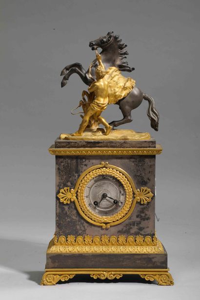null 
An ormolu and patinated metal clock representing the horse of Marly after Coustou;...