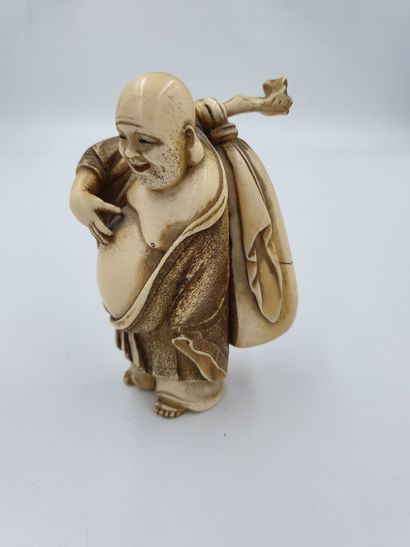 null 
Ivory OKIMONO representing a pot-bellied character holding his bundle
China,...