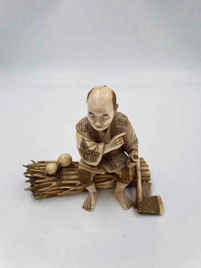 null 
Ivory OKIMONO representing a character sitting on a bundle
China, Late 19th-early...