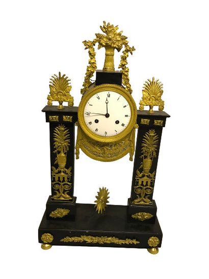 null 
Portico clock in black marble, ormolu and chased bronze decorated with flowering...