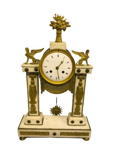 null 
A white marble and ormolu and chased bronze PORTICAL CLOCK decorated with women...