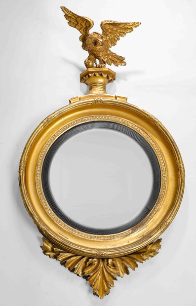 null 
A large wood and gilded stucco mirror frame, decorated with a frieze of water...