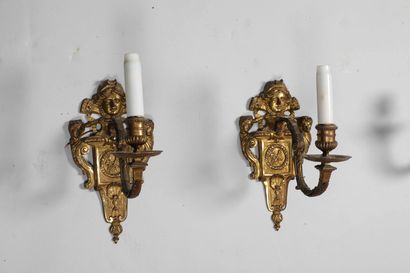 null 
A pair of ormolu sconces with one arm of light; shaft decorated with quivers...