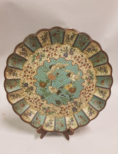 null 
CHINA 19th century
A large dish in polylobed copper and cloisonné enamels decorated...