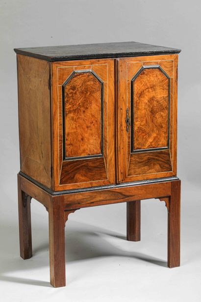 null 
Small oak and veneer inlaid chest. It opens with two doors revealing an interior...