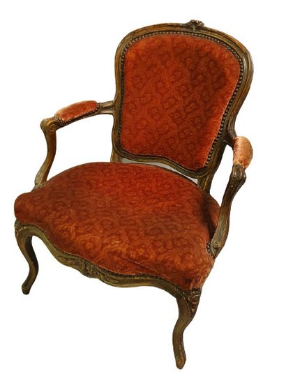 null 
Natural wood cabriolet armchair, moulded and carved with flowers, red velvet...