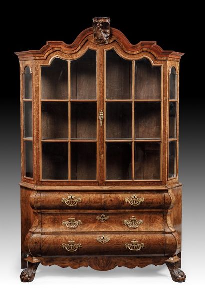 null 
A burl wood veneer display cabinet opening with two glass doors in the upper...