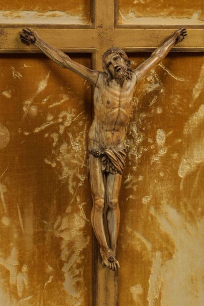 null 
Ivory crucifix on a gilded wooden cross in a gilded and carved wooden frame...