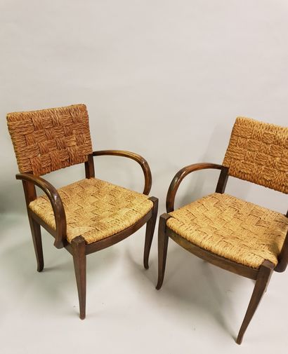 Paire de fauteuils en bois laqué attribués à Houdoux, dossier et assise en cordage...