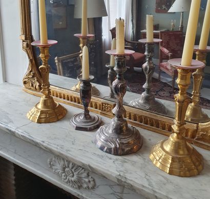 null 
Lot including a pair of gilded metal torches; a small silver plated torch with...