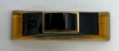 FENDI " Fendi " FENDI "Fendi 

Glass bottle of half-moon shape, titled. Black stopper...