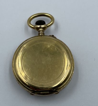 MONTRE DE COL en or jaune 18K (750 millièmes), le bord à décor de rinceaux MONTRE...