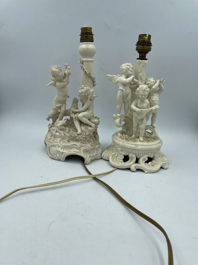 DEUX LAMPES TWO LAMPS in cookie with decoration of cherubs musicians with an arm...