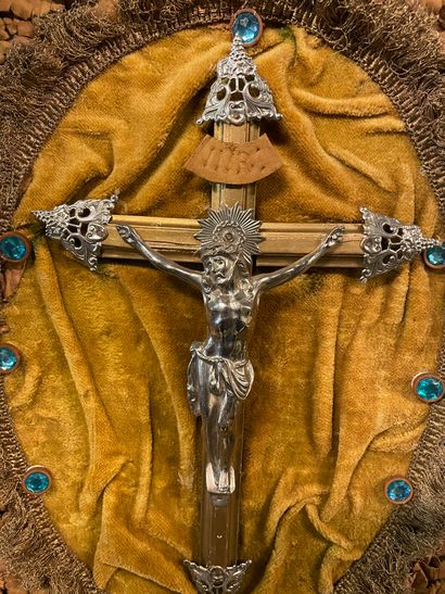 CRUCIFIX CRUCIFIX in metal and gilded metal on a velvet and leather background and...