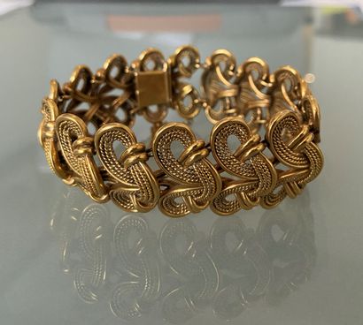 BRACELET EN OR Large yellow gold bracelet with openwork stylized links

gross weight:...