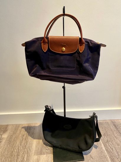 LONGCHAMP LONGCHAMP

Set of 2 small bags: one with a black canvas handle and the...