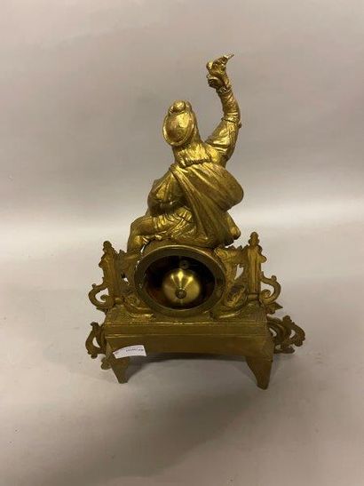 PENDULE Gilded metal HANGER decorated with a young girl hunter holding a bird resting...