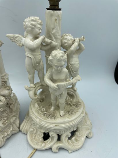 DEUX LAMPES TWO LAMPS in cookie with decoration of cherubs musicians with an arm...