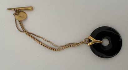 null 
YVES SAINT LAURENT

BRACELET two rows in gilded metal, black disc with gilded...