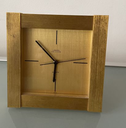LANCEL LANCEL

Brushed metal alarm clock, quartz movement. Swiss work.

Numbered...