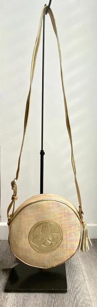 POURCHET POURCHET

Round bag in canvas and braided leather adorned with a golden...