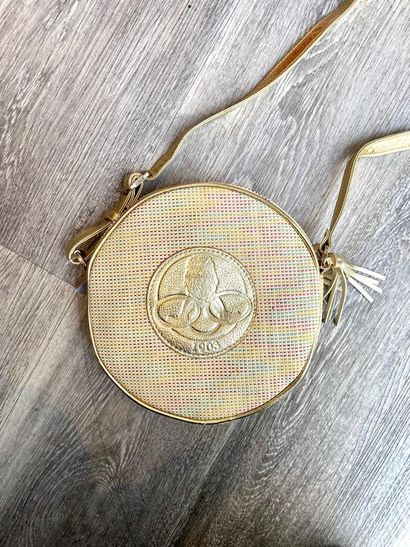 POURCHET POURCHET

Round bag in canvas and braided leather adorned with a golden...