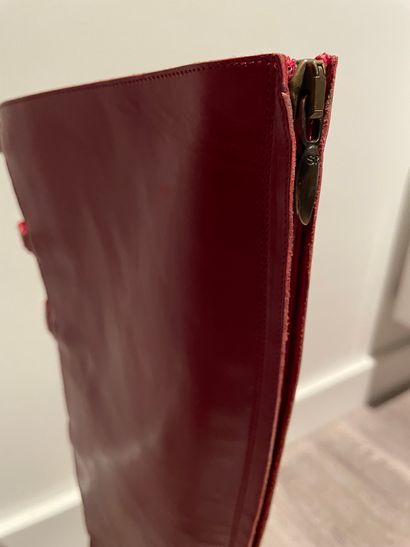 Sonia RYKIEL Sonia RYKIEL

PAIR OF Poppy red leather boots with straps and buttons,...
