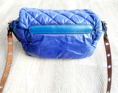 Sonia RYKIEL Sonia RYKIEL

Blue quilted waterproof canvas and leather bag, monogrammed...