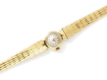 OMEGA OMEGA
Ladies' wristwatch in gold 750 thousandths, ivory dial with applied indexes....