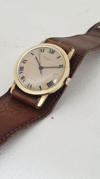 null Jean PERRET Geneva circa 1975.
Gold-plated wristwatch, round case, smooth bezel,...