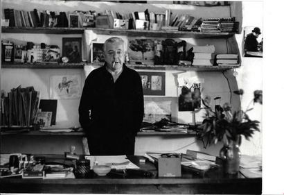 null J. BELLINI (1907-1990). Jacques Prévert in his office at the cité Véron in Paris....