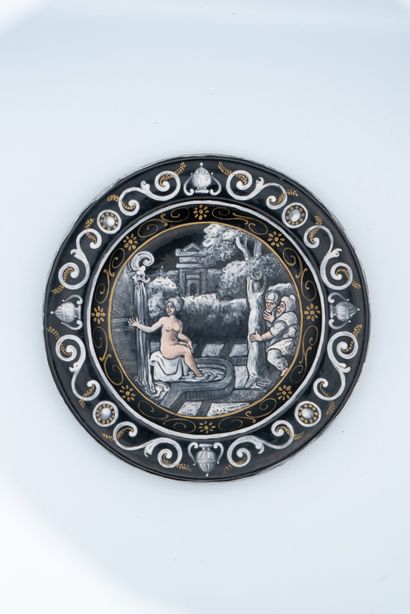 null 
Enamel plate painted in grisaille with gold and rose highlights for the complexions...