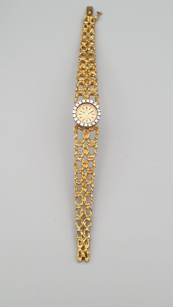 null OMEGA, circa 1960

Elegant ladies' watch in 18K yellow gold and diamonds. 

Round...