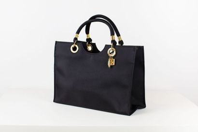 null 
CELINE


Black grained leather bag, opening at the top with a circular golden...