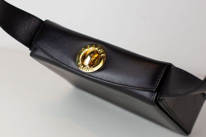 null 
CELINE


Black grained leather bag, opening at the top with a circular golden...