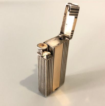 null BOUCHERON - Lighter with meche in silver (800 thousandths) doubled by gold 18K...