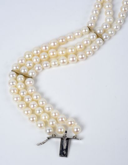 null Bracelet of three rows of white cultured pearls. It is embellished with an important...