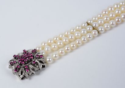 null Bracelet of three rows of white cultured pearls. It is embellished with an important...