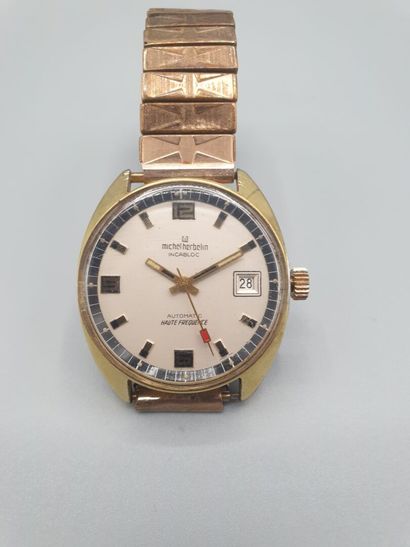Michel HERBELIN Ref.6179 vers 1970. 

Montre bracelet en métal doré, boitier tonneau...