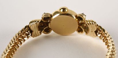 OBREY Montre bracelet de dame en or jaune 18K (750 millièmes). 

Cadran rond, index...