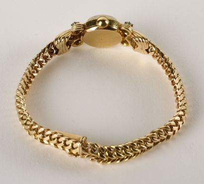 OBREY Montre bracelet de dame en or jaune 18K (750 millièmes). 

Cadran rond, index...