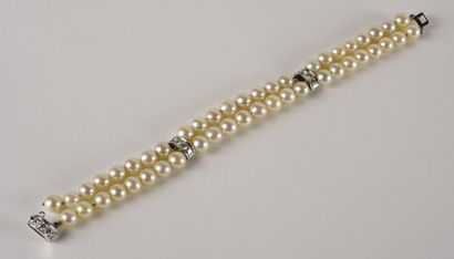 null Bracelet composed of two rows of white cultured pearls in fall decorated with...