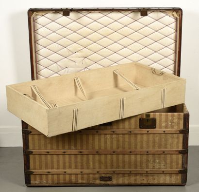 LOUIS VUITTON Wooden mail trunk, lined with a striped canvas, the edges in leather....